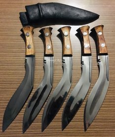 The BUSHCRAFT MK 3 is based on the Official Standard Issue MK3  Kukri of WW2 and has been adapated by Heritage Knives for Bushcrafting.   The BUSHCRAFT MK3 Kukri was created for active Bushcrafting and heavy duty use in varied terrain. It is a development from our Classical MK3 (12") and  Outdoor MK3 (10" blade), the BUSHCRAFT MK3 KUKRI has a 10,5" long blade made with new high carbon steel. The bevel is higher then in the Outdoor MK3 and the upper section of the blade is hollow forged. The high bevel allows each cut to go deeper into the object/material and saves you energy. Besides Bushcrafting it makes a excellent fighting and hunting knife.  All our kukris and knivese are hand forged and given a optimum heat treat. The hexagonal wooden handle which gives a very secure grip allowing both the regular and new user comfort in use.  Heritage Knives is the first knife maker in Nepal to offer a hexagonal handle, which is based on private purchase Kukri´s of the WW2 era.   The Bushcraft MK3 is well suited for various tasks in nature, from jungle to forrest, from mountains to plains and is of course in Full tang.   It is a ideal companion for a active life in nature when you need a Kukri knife that you will use alot. heritage knives, kilatools. camping, outdoor, standard issue pattern 20th century british indian army utility knife. best quality and professional knife maker. Khukuri. 