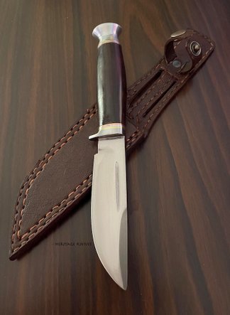 Boone hunting knife with false edge, hand forged. Wade & Butcher, sheffield england original, reproduction.  A great knife for camping, bushcraft, EDC, military. 4,5 inch blade., overall 9,25 inch. handforged with high carbon steel by Heritage Knives Nepal.  