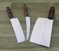 It was with a passion for various blades, knives, kukris, swords and such that Heritage Knives got established. Thus we do occationally create small batches of various knives for collectors and users.  Our range of knives & blades includes from professional Chef & Kitchen knives to other blades and Machetes for Survival training & Bushcraft courses.    Before going about any knife we research it from a historical, utility and professional perspective to get the nitty gritty details correct and start making the first examples before finalising on a prototype.  Different knives feel different as they were made for a certain purpose/use, these factors must be included in the making process, its not only about how it looks. Its easy to make a knife like object that looks like a knife but behaves not like a knife. Our standards are high, we expect alot from what we do so that you can relax and trust your blade from Heritage Knives.   The skills accumulated through making various knives, from small to large we partly show here by offering a carefully choosen selection of hand forged high carbon knives based on proffesional, civilian utility and/or military use. These knives are made as both collectors items and user tools, they will serve you well and can be trusted to do their duty.  Please keep in mind each knife we make is carefully hand forged without power hammers and other advanced tools (though for Nepal we are rather high tech), forged by hand in a traditional way, where we have combined aspects of black smithing based on both eastern and western traditions & methods to get the best results.   Add we are located in Nepal where its difficult to access many of the knives that are offered in other countries or parts of the World. This makes us extra proud to be able to have the originals of what we are basing the reproductions on, so that we can understand the dynamics, feel and soul of the knife before we attempt to re-create and/or modify it. Heritage Knives firmly belives each blade & knife has a soul of its own. Speak to your blade!